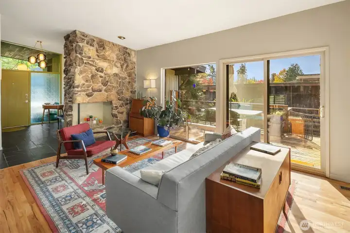 Check out that peanut brittle fireplace and the amazing light fixture in the entry way!