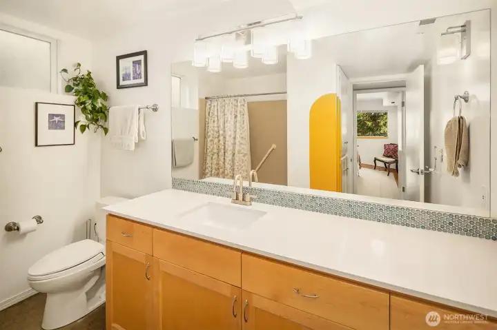 Lower level full bathroom has lots of storage