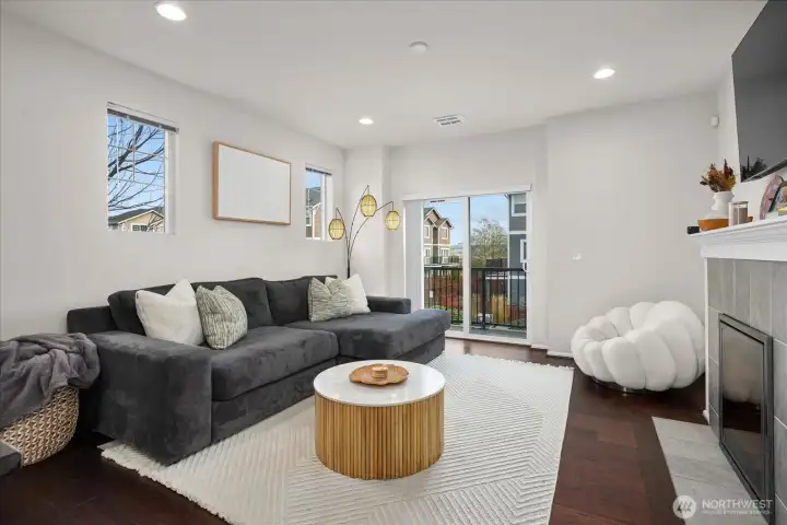 Bright main-floor gathering space with territorial outlooks from multiple windows