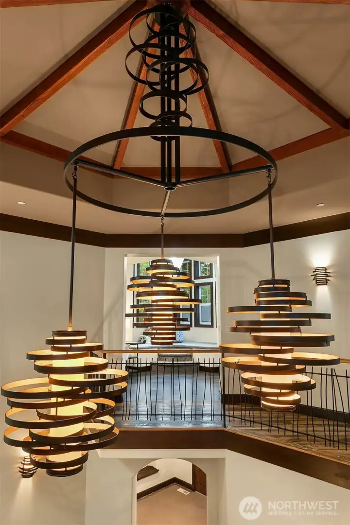 Dramatic, custom crafted chandelier commands your attention in the rotunda.