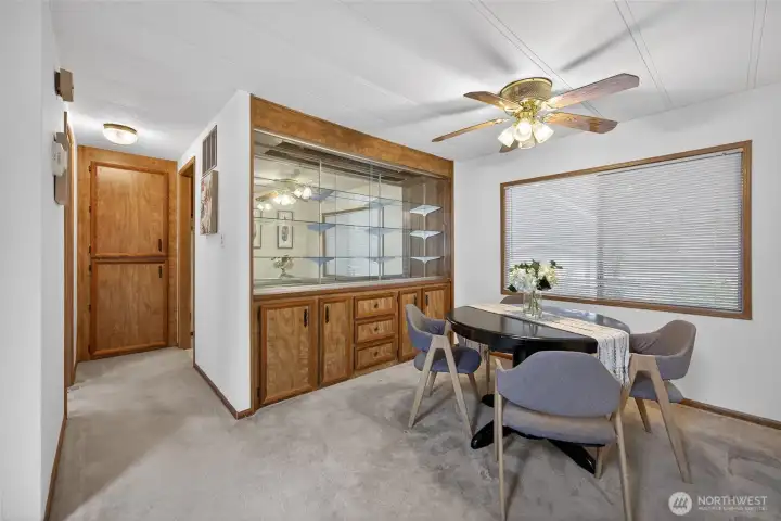 Separate dining room with a built in hutch that increases your storage.