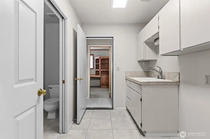 Laundry room and 1/2 bath off of formal dining room