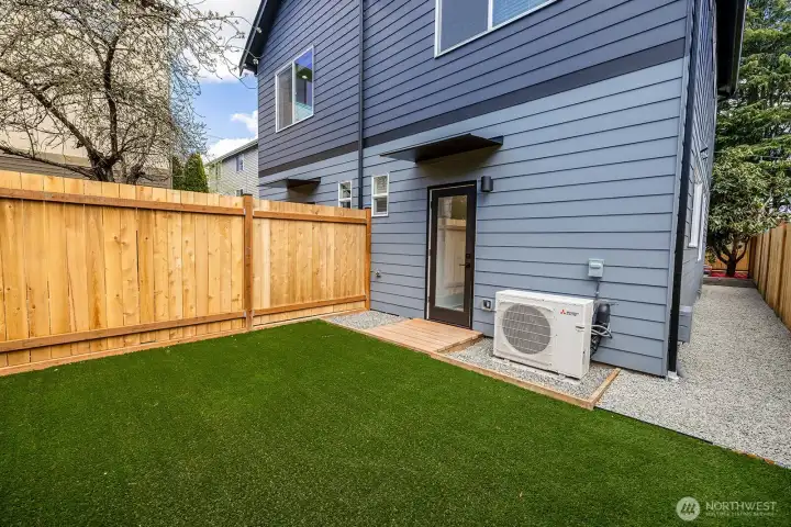 Looking back towards the home, notice the side walkway connects the front and backyards.