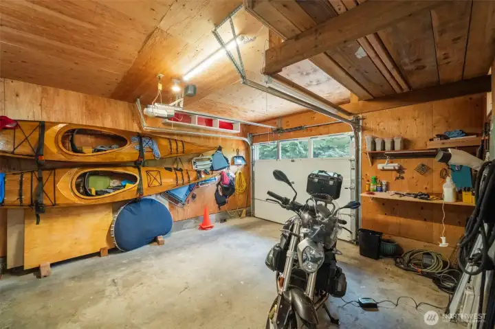 Main garage-additional garage currently used as a shop but easily transformed back into a 2nd enclosed garage.