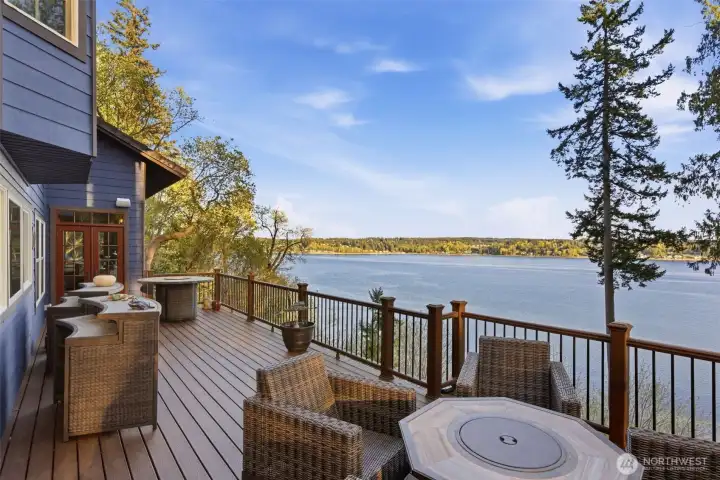 Main floor seamlessly flows outside to an updated Trex decking with gorgeous, huge views.