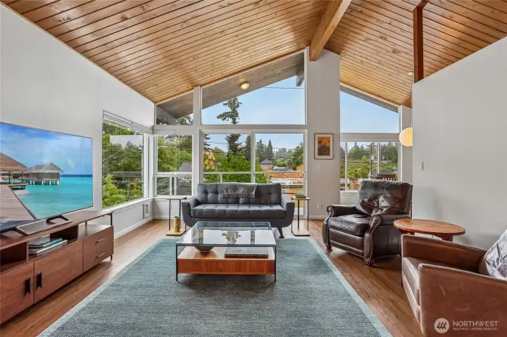 This mid century condo is a show stopper with floor to ceiling windows and tongue and groove wood beam ceilings. This mid century condo is a show stopper with floor to ceiling windows and tongue and groove wood beam ceilings.