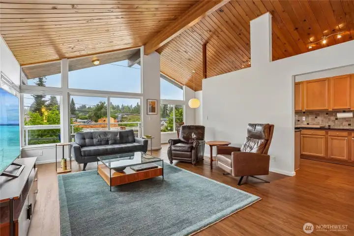 Great room with view of kitchen, balcony and dining room. Great room with view of kitchen, balcony and dining room.