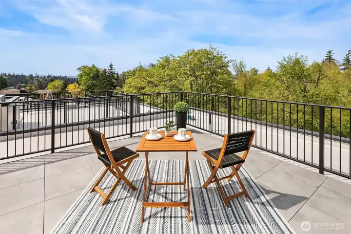 Rooftop retreat with space to lounge, entertain, and take in the views of Downtown Bellevue and Seattle skyline