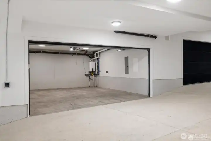 Striking commercial-grade, industrial garage crafted with over 14 million pounds of concrete—bold, rare, and architecturally impressive.