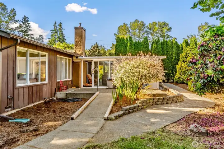 ramped entrance to pool, backyard garden