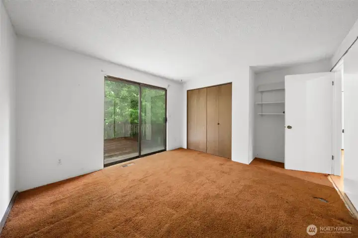 Secondary bedroom on main level opens onto the deck. Secondary bedroom on main level opens onto the deck.