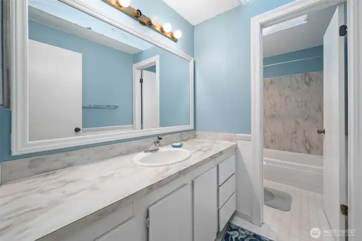 Main level hall bathroom. Separate sink & toilet/bathroom makes for easy use for people getting ready. Main level hall bathroom. Separate sink & toilet/bathroom makes for easy use for people getting ready.