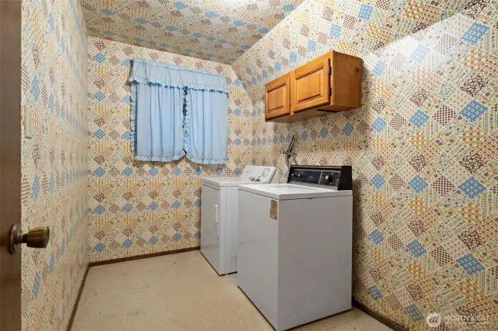 Generous laundry room at the bottom of the stairs. Generous laundry room at the bottom of the stairs.