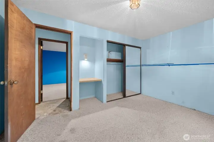 Larger lower level bedroom with built-in desk. Larger lower level bedroom with built-in desk.