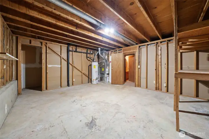Partially finished additional room on right side lower level. Could add kitchen and exterior door here. Partially finished additional room on right side lower level. Could add kitchen and exterior door here.