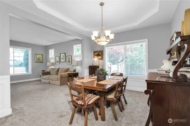 Dining room with lots of light from the windows.