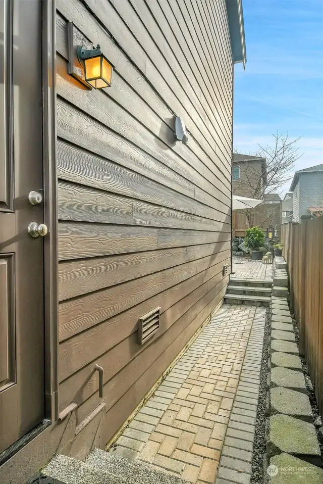 View from the side garage door to the courtyard/patio area