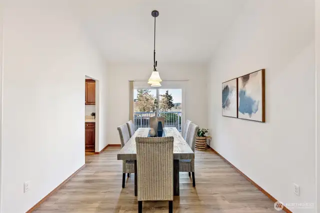 Spacious dining room with deck access.