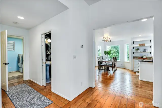 Looking from the living room towards the kitchen.  Powder bath and utility room to the left.