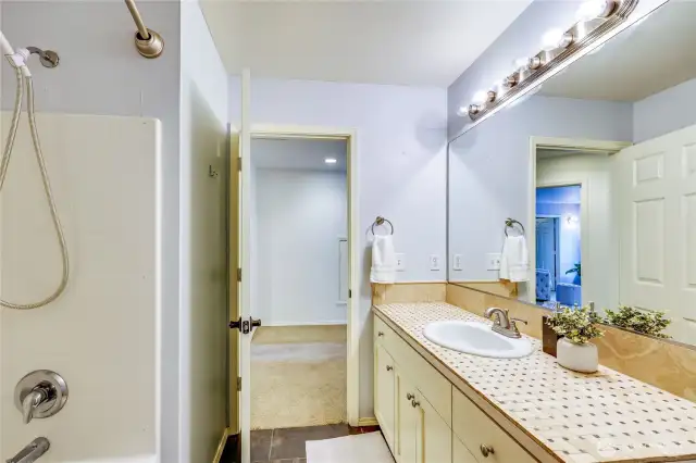 2nd bathroom upstairs between the primary suite and 2nd bedroom.