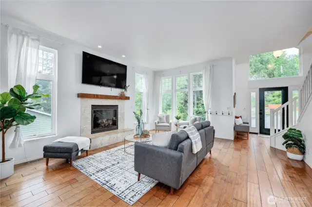 Tall ceilings and windows allow maximum sun and light to fill this living room.