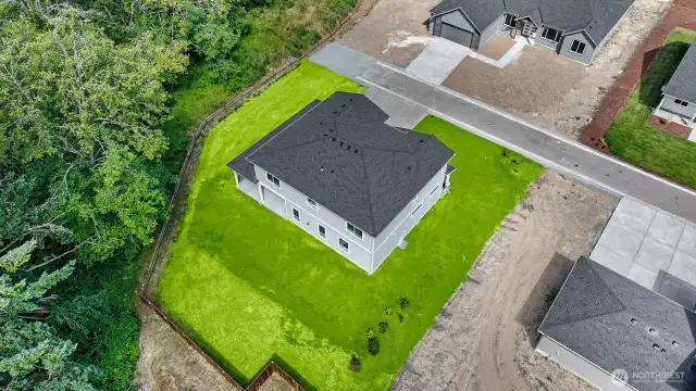 Grass has been virtually added. Sod will be installed on areas of existing top soil.