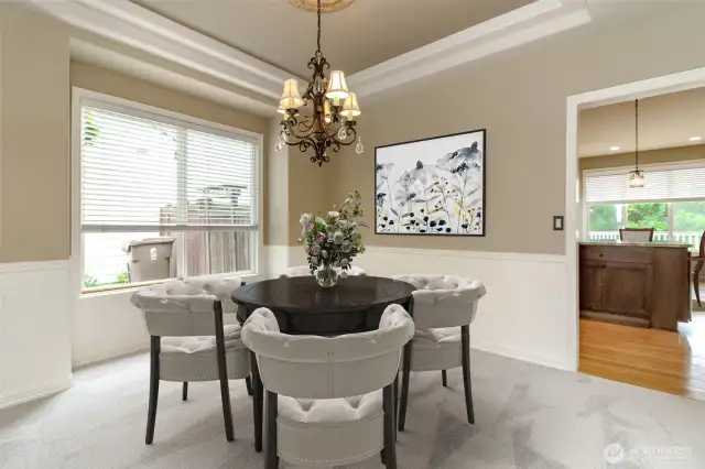 Easy entertaining when your formal dining room is write off the kitchen. Look at the wainscoting!