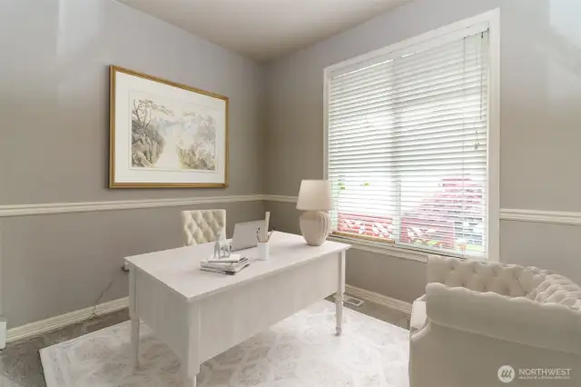 From the entry way, walk into your private office w/ glass French doors & chair railing.