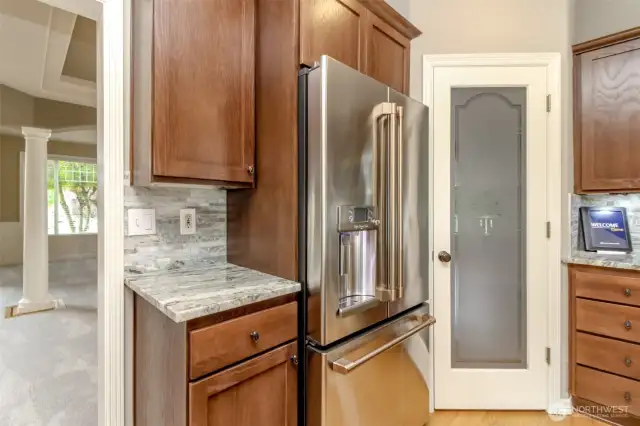 New Cafe Elite fridge with HOT WATER dispenser next to lighted walk-in pantry.