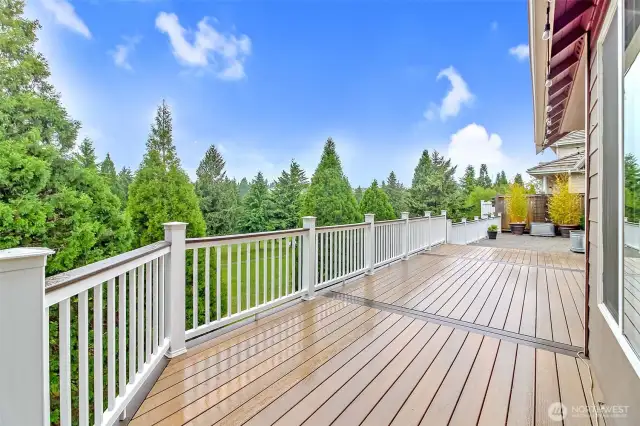 An entertainer’s delight, this TimberTech deck seamlessly leads to a spacious concrete patio overlooking the 5th hole. Enjoy hosting barbecues or relaxing outdoors, where privacy and picturesque views surround you.