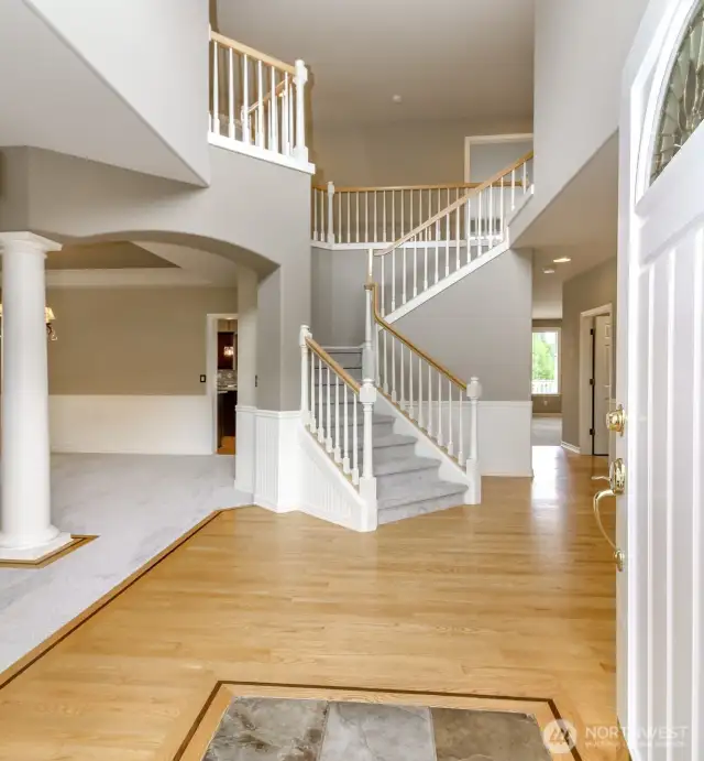 Formal entry with real hard woods and formal staircase. NEW CARPET throughout the entire house!