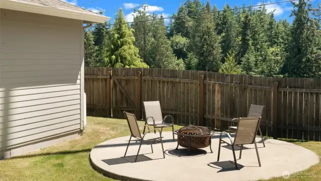 Poured concrete patio for entertaining in the side yard