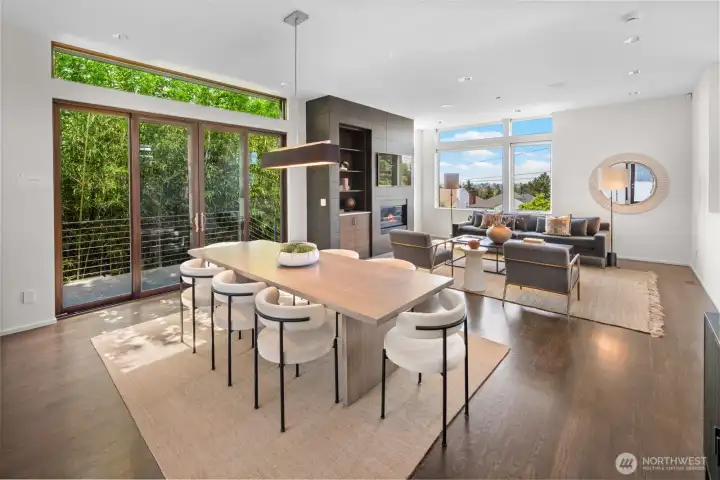 Dining and open kitchen, featuring fir clad Marvin sliding doors to the side patio leading to the front and back yard spaces