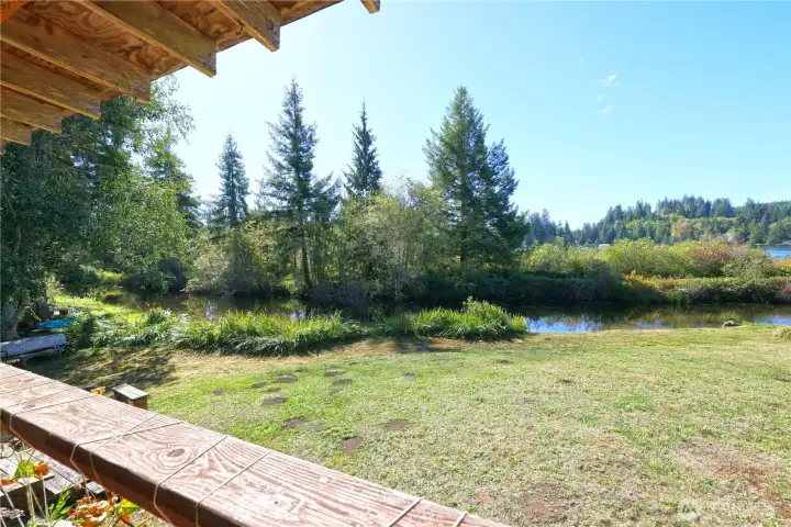 View from the deck onto small canal entering into the lake.