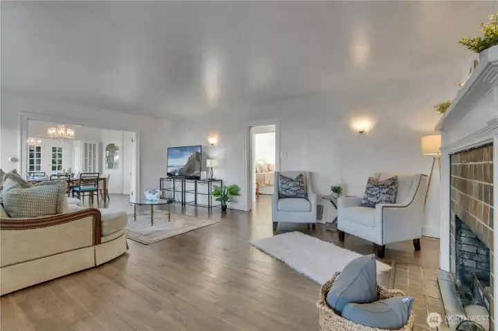 Upon entering, you’ll immediately notice how the open living spaces flow seamlessly from the living room to the dining area and sunroom.