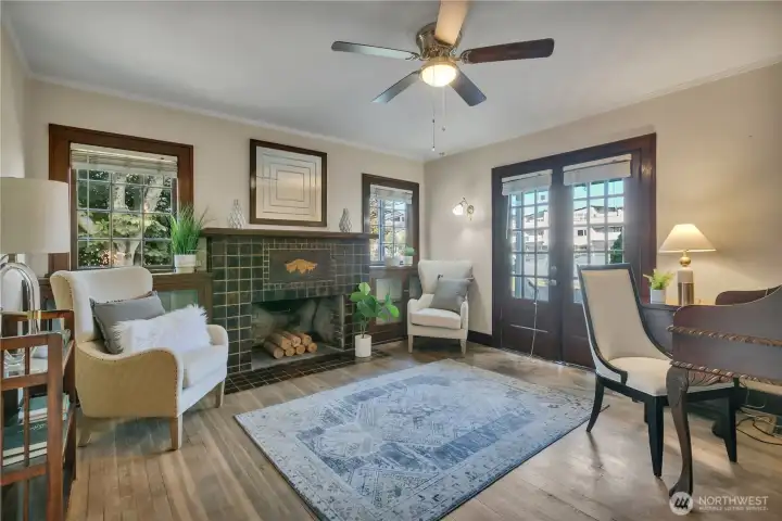 Main-level bedroom/den with rich millwork, & French doors to outdoors.