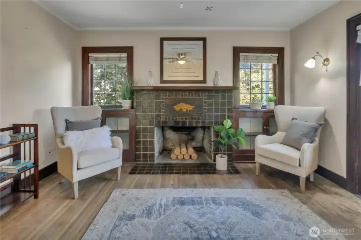 A stunning Mt. Rainier–etched tile fireplace anchors the room.