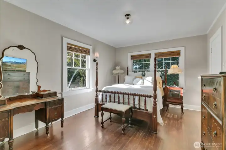 Main-level bedroom tucked privately in the corner of the home.