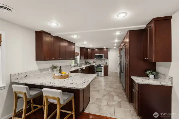 Granite Counter tops with Breakfast nook.