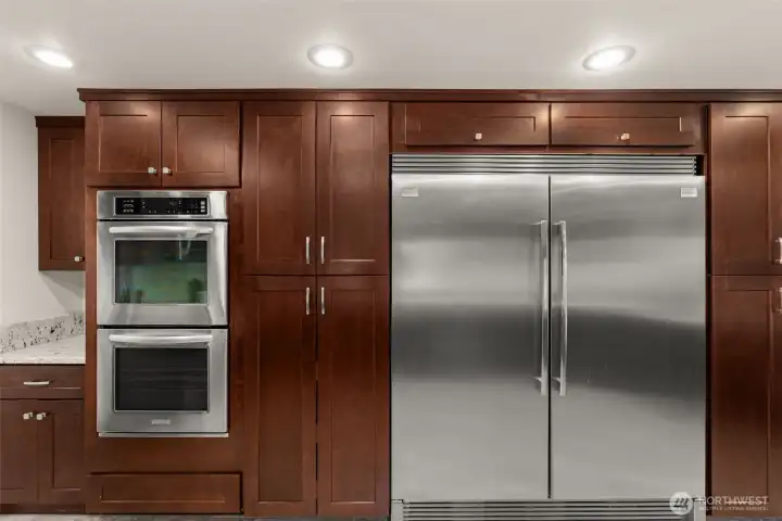 Double oven, range oven, Double Dishwasher, and Double Fridge. Cupboard pull outs and plenty of counter top space