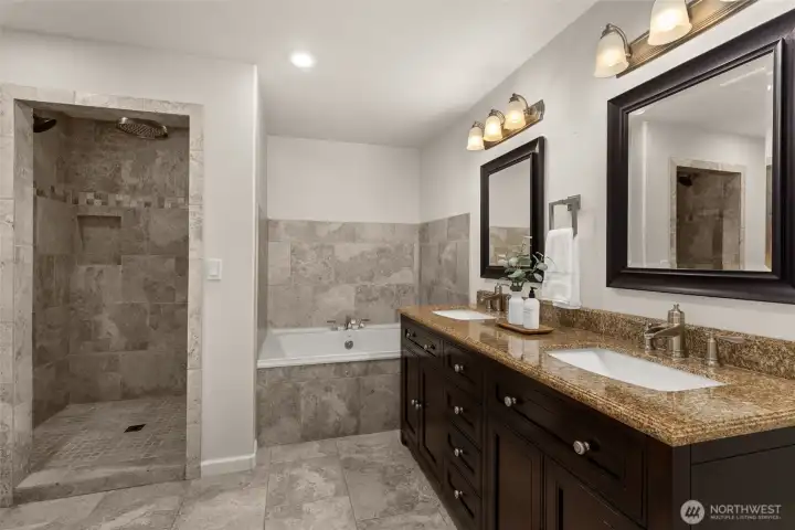 Second Primary Suite walk in shower, tub and double vanity.