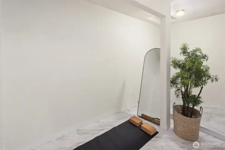 Just off the office, a private space perfect for yoga or work outs.