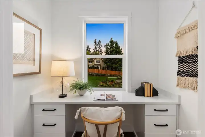 Pocket Office: Light-filled pocket office overlooks the front of the home, creating a peaceful spot for remote work or homework. Built-in desk and storage keep the space functional without interrupting the flow of the main level.    Photos are from the model home at Foxmoore and for visualization purposes only. Plans, colors, building orientation, finishes, home outlook, and other details can and WILL vary.