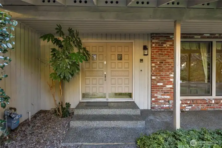 Double door entry with covered front patio