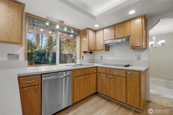 Updated kitchen looking towards private back patio