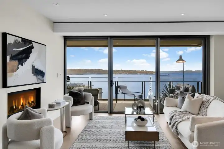 The living room features a gas fireplace and opens to a large view terrace.