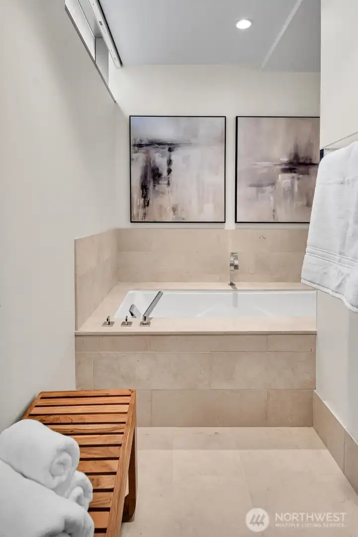 Relax and refresh in the primary bathroom soaking tub.