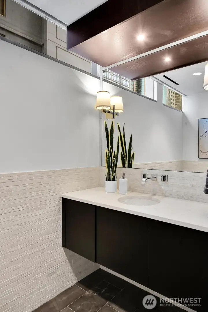 There is an elegant half bathroom in this residence.