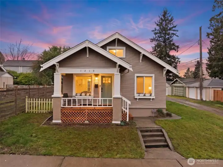 Charming Craftsman Bungalow with Covered Front Porch at Twilight