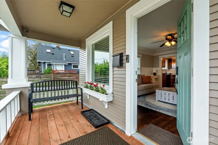 Charming Covered Front Porch with Peek Inside to Living Room
